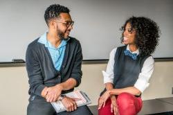 Photo of students practicing conversation in classroom