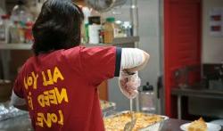 Woman volunteering serving food